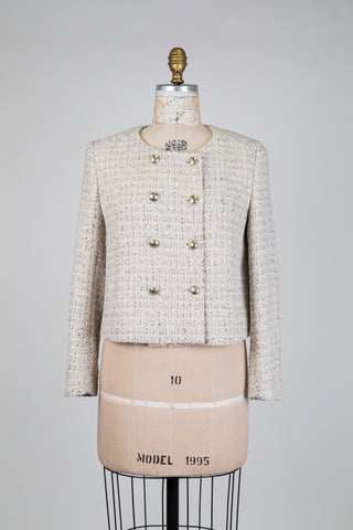 Cream-colored tweed jacket in Chanel style (4-6-8-12-16)