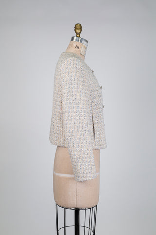 Cream-colored tweed jacket in Chanel style (4-6-8-12-16)
