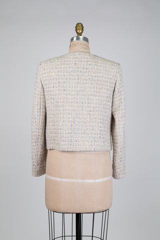 Cream-colored tweed jacket in Chanel style (4-6-8-12-16)