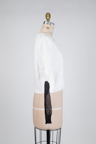 White cardigan with black sheer sleeves (one size fits all)