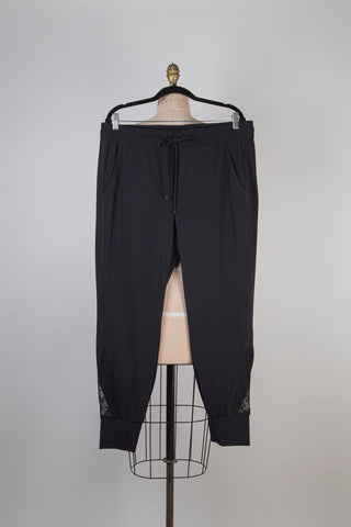 Black jogger pants with mesh inserts (6 and 16)