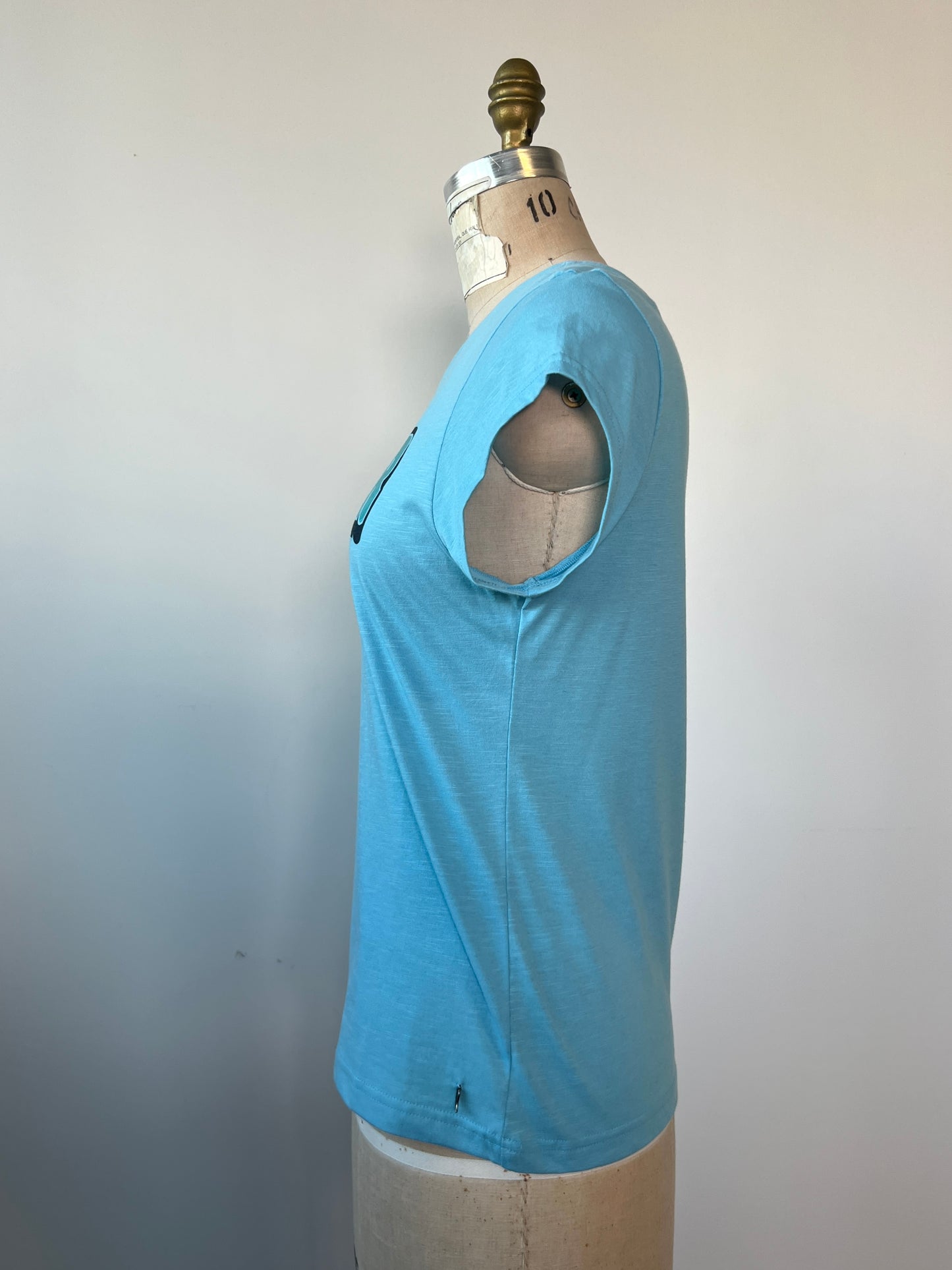 T-shirt bleu à imprimé Coster turquoise métallisé (S)