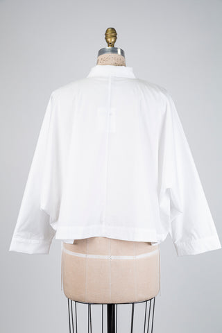 Chemisier blanc coupe high low (S/M)