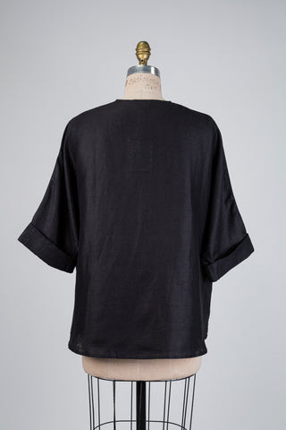Black twisted-neck blouse (S/M+)