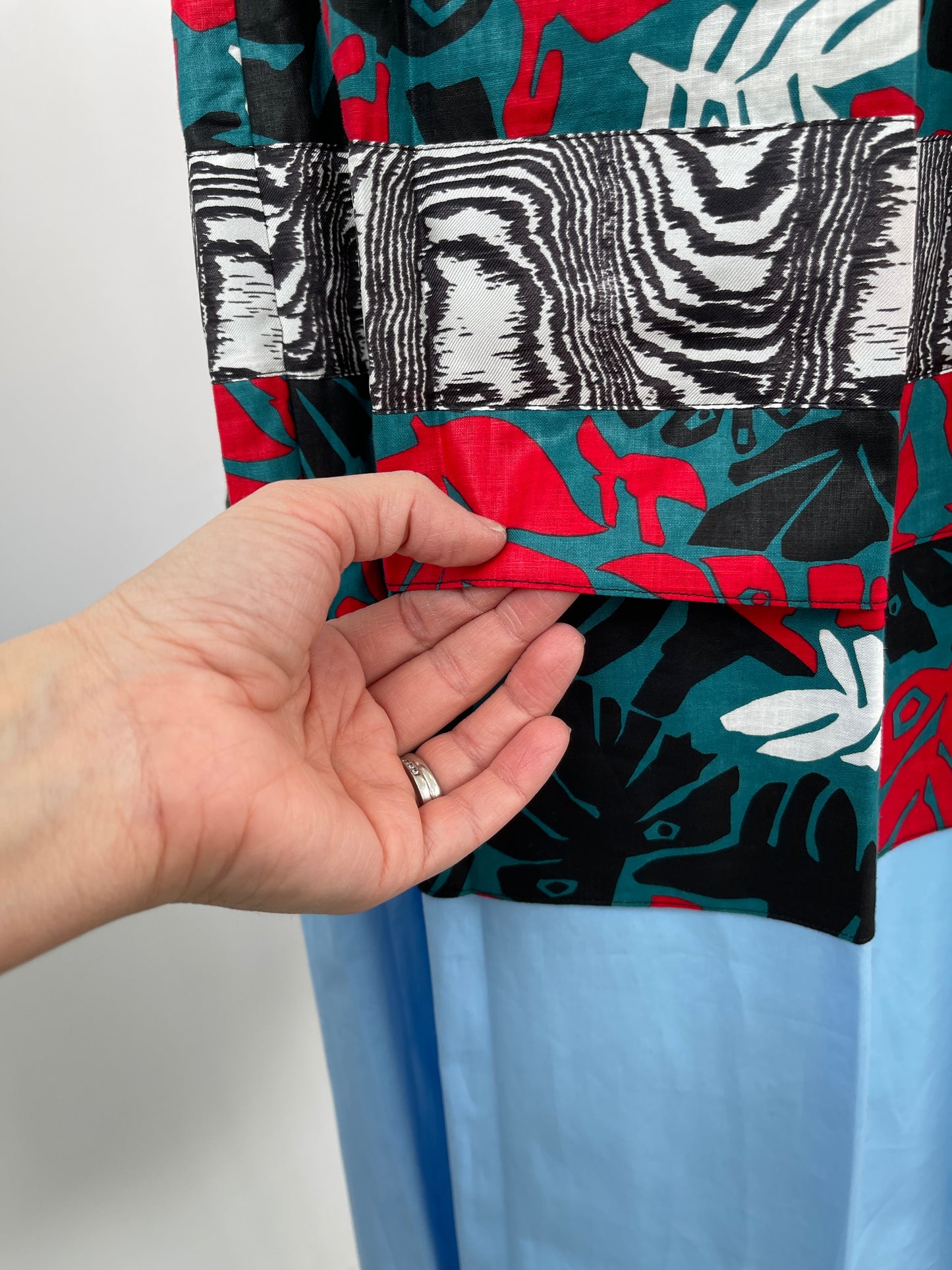 Jupe plissée à imprimé floral et ourlet bleu (XS/S)