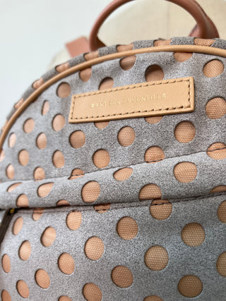 Grey and pink backpacks with perforated polka dots